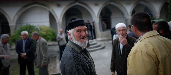Crimean Tatars speak to each other after the prayer in a mosque marking the Eid al-Adha, celebrated by Muslims worldwide, in Bakhchisarai, Crimea Crimean Tatars speak to each other after the prayer in a mosque marking the Eid al-Adha, celebrated by Muslims worldwide, in Bakhchisarai, Crimea - Sputnik International