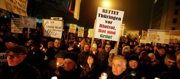 Protesters came out in the central Germany city of Erfurt yesterday evening to challenge the possible election of Left Party leader Bodo Ramelow to the position of Minister-President for the state of Thuringia. Protesters came out in the central Germany city of Erfurt yesterday evening to challenge the possible election of Left Party leader Bodo Ramelow to the position of Minister-President for the state of Thuringia. - Sputnik International