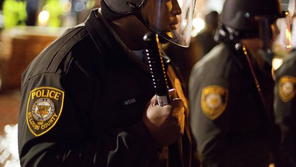 Police stand guard during a demonstration outside the Ferguson Police Department, Saturday, Nov. 22, 2014, in Ferguson, Mo. Police stand guard during a demonstration outside the Ferguson Police Department, Saturday, Nov. 22, 2014, in Ferguson, Mo. - Sputnik International