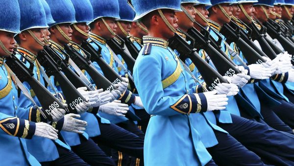 Thai Royal Guards march in front of the Grand Palace, during a military parade as a part of a celebration for the upcoming birthday of Thailand's King Bhumibol Adulyadej, in Bangkok, December 2, 2014 - Sputnik International