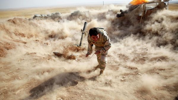 A Kurdish Peshmerga fighter launches mortar shells towards Zummar, controlled by Islamic State (IS), near Mosul in this September 15, 2014 file photo A Kurdish Peshmerga fighter launches mortar shells towards Zummar, controlled by Islamic State (IS), near Mosul in this September 15, 2014 file photo - Sputnik International