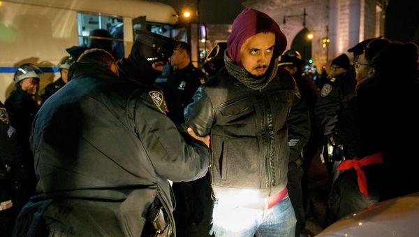 A person is taken into custody at the Manhattan side of the Manhattan Bridge Thursday, Dec. 4, 2014, in New York A person is taken into custody at the Manhattan side of the Manhattan Bridge Thursday, Dec. 4, 2014, in New York - Sputnik International