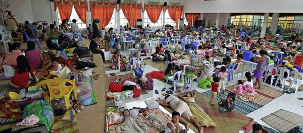 People take shelter inside a evacuation centre after evacuating from their homes due to super-typhoon Hagupit in Surigao city, southern Philippines December 5, 2014 People take shelter inside a evacuation centre after evacuating from their homes due to super-typhoon Hagupit in Surigao city, southern Philippines December 5, 2014 - Sputnik International