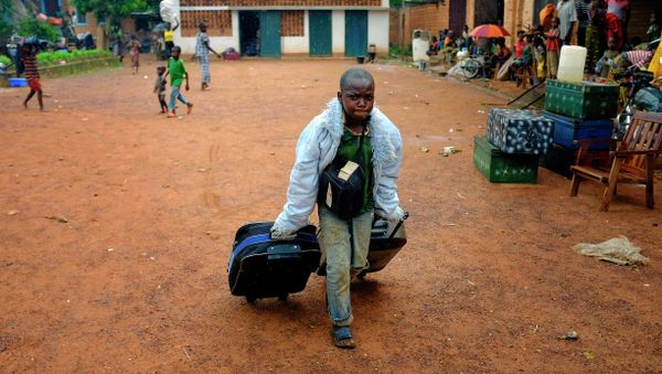 A young christian refugee carries his bags in the main church of Bambari, Central African Republic A young christian refugee carries his bags in the main church of Bambari, Central African Republic - Sputnik International