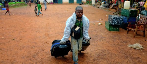 A young christian refugee carries his bags in the main church of Bambari, Central African Republic A young christian refugee carries his bags in the main church of Bambari, Central African Republic - Sputnik International