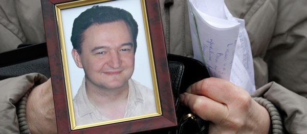 Portrait of lawyer Sergei Magnitsky who died in jail, is held by his mother Nataliya Magnitskaya, as she speaks during an interview with the AP in Moscow Portrait of lawyer Sergei Magnitsky who died in jail, is held by his mother Nataliya Magnitskaya, as she speaks during an interview with the AP in Moscow - Sputnik International