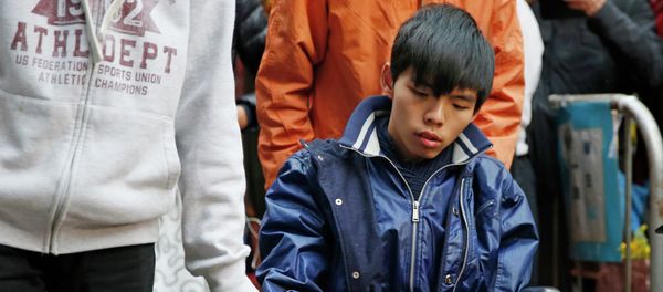 Student leader Joshua Wong attends a news conference as he sits on a wheel chair Student leader Joshua Wong attends a news conference as he sits on a wheel chair - Sputnik International