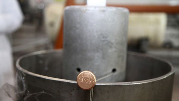 This picture released by Islamic Republic News Agency, IRNA, shows an International Atomic Energy Agency (IAEA) seal on a piece of equipment at one of Iran's uranium enrichment facilities at the Natanz plant - Sputnik International