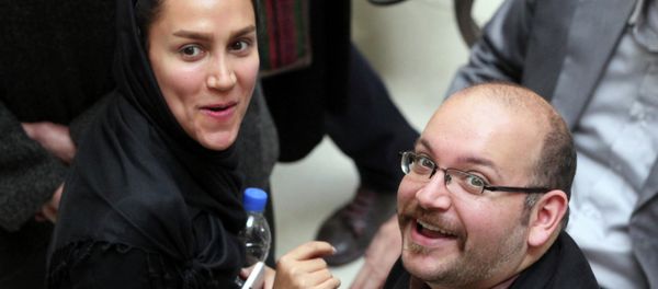 In this photo taken on April 11, 2013, Jason Rezaian, right, an Iranian-American correspondent for the Washington Post, and his wife Yeganeh Salehi In this photo taken on April 11, 2013, Jason Rezaian, right, an Iranian-American correspondent for the Washington Post, and his wife Yeganeh Salehi - Sputnik International