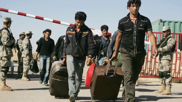 Afghan refugees enter Afghan territory after leaving Iran at the Islam Qala border crossing in Kohsan, Herat, west of Kabul, Afghanistan, Sunday, Nov.11, 2012 Afghan refugees enter Afghan territory after leaving Iran at the Islam Qala border crossing in Kohsan, Herat, west of Kabul, Afghanistan, Sunday, Nov.11, 2012 - Sputnik International