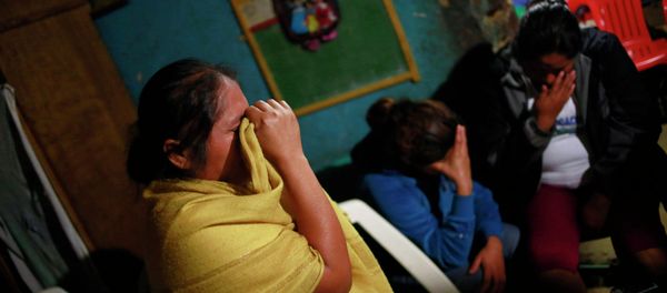 Edith Mora Mora Venancio, sister of Alexander Mora Venancio mourns next to others women at their house in El Pericon, in the southern Mexican state of Guerrero, December 6, 2014 Edith Mora Mora Venancio, sister of Alexander Mora Venancio mourns next to others women at their house in El Pericon, in the southern Mexican state of Guerrero, December 6, 2014 - Sputnik International