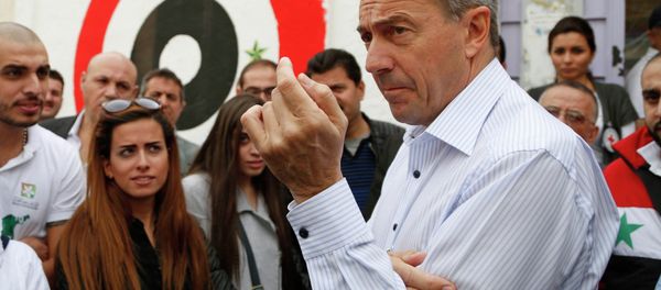 Peter Maurer, president of the International Committee of the Red Cross (ICRC), speaks with volunteers outside a shelter hosting displaced families in the Damascus suburb of Barzeh November 14, 2014 Peter Maurer, president of the International Committee of the Red Cross (ICRC), speaks with volunteers outside a shelter hosting displaced families in the Damascus suburb of Barzeh November 14, 2014 - Sputnik International