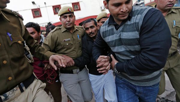 Policemen escort driver Shiv Kumar Yadav (3rd R in black jacket) who is accused of a rape outside a court in New Delhi December 8, 2014 Policemen escort driver Shiv Kumar Yadav (3rd R in black jacket) who is accused of a rape outside a court in New Delhi December 8, 2014 - Sputnik International