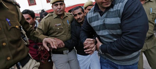 Policemen escort driver Shiv Kumar Yadav (3rd R in black jacket) who is accused of a rape outside a court in New Delhi December 8, 2014 Policemen escort driver Shiv Kumar Yadav (3rd R in black jacket) who is accused of a rape outside a court in New Delhi December 8, 2014 - Sputnik International