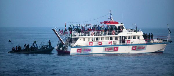 Image reviewed by the Israeli military and taken aboard an Israeli Naval vessel, Israeli Navy soldiers intercept one of several boats headed towards the Gaza Strip, in international waters in the Mediterranean Sea - Sputnik International