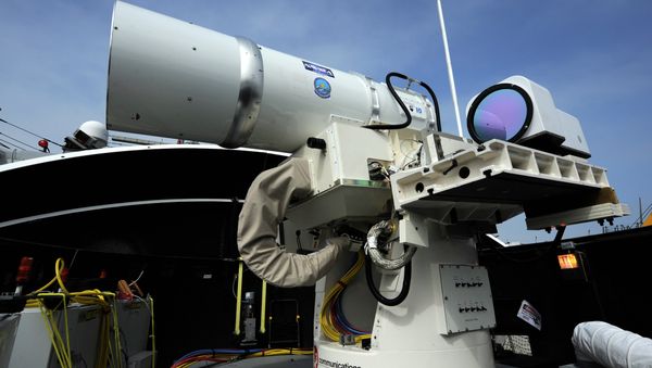 The Laser Weapon System (LaWS) temporarily installed aboard the guided-missile destroyer USS Dewey (DDG 105) in San Diego The Laser Weapon System (LaWS) temporarily installed aboard the guided-missile destroyer USS Dewey (DDG 105) in San Diego - Sputnik International