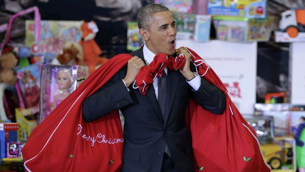U.S. President Barack Obama with gifts by Christmas for children of military-infantrymen U.S. President Barack Obama with gifts by Christmas for children of military-infantrymen - Sputnik International