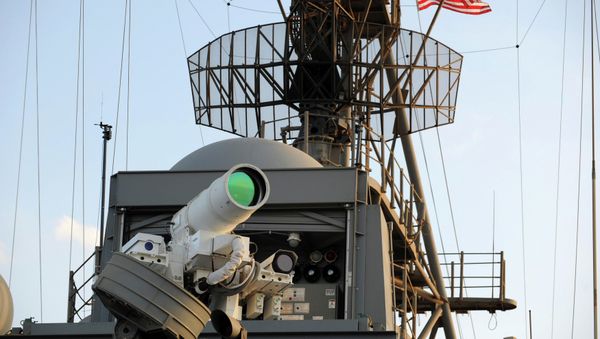 The laser weapon system (LaWS) is tested aboard the USS Ponce amphibious transport dock during an operational demonstration while deployed in the Gulf. File photo - Sputnik International