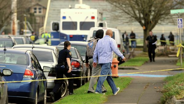 Police have arrested a suspect for the shooting injury of four students at Rosemary Anderson High School in Portland, Oregon. Photo: Police evacuating students from the school Friday Police have arrested a suspect for the shooting injury of four students at Rosemary Anderson High School in Portland, Oregon. Photo: Police evacuating students from the school Friday - Sputnik International