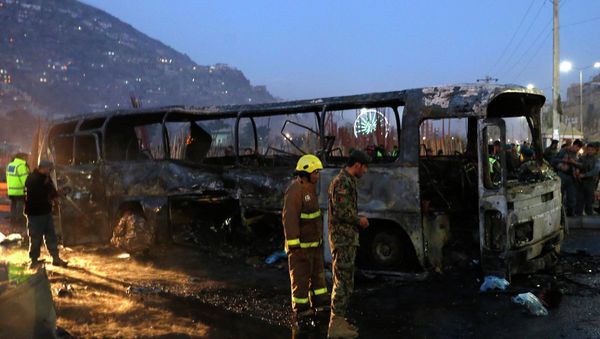 Afghan security forces inspect at the site of a suicide attack in Kabul - Sputnik International