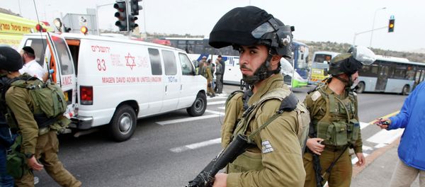 Israeli soldier stand at the scene where a Palestinian attacked civilians with a chemical substance Israeli soldier stand at the scene where a Palestinian attacked civilians with a chemical substance - Sputnik International