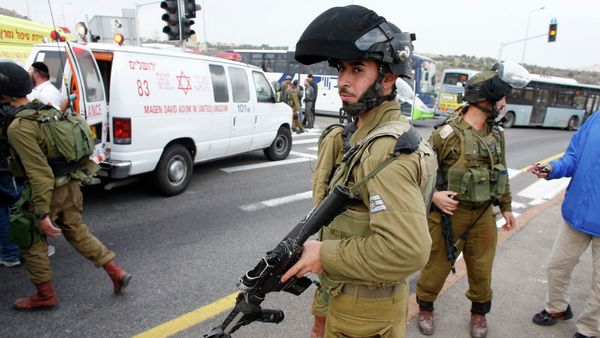 Israeli soldier stand at the scene where a Palestinian attacked civilians with a chemical substance Israeli soldier stand at the scene where a Palestinian attacked civilians with a chemical substance - Sputnik International