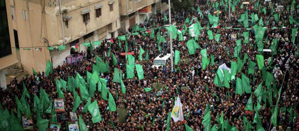 Palestinians Hamas supporters take part in a rally ahead of the 27th anniversary of the movement founding, in Jabaliya in the northern Gaza Strip December 12, 2014 Palestinians Hamas supporters take part in a rally ahead of the 27th anniversary of the movement founding, in Jabaliya in the northern Gaza Strip December 12, 2014 - Sputnik International