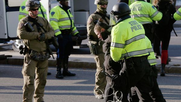 Police detain protestors during a demonstration against recent grand jury decisions not to indict police officers in the deaths of Michael Brown and Eric Garner, in Boston, Massachusetts December 13, 2014 Police detain protestors during a demonstration against recent grand jury decisions not to indict police officers in the deaths of Michael Brown and Eric Garner, in Boston, Massachusetts December 13, 2014 - Sputnik International