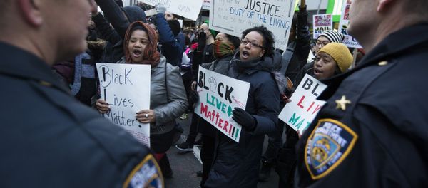 Demonstrators march in New York, Saturday, Dec. 13, 2014, during the Justice for All rally and march Demonstrators march in New York, Saturday, Dec. 13, 2014, during the Justice for All rally and march - Sputnik International