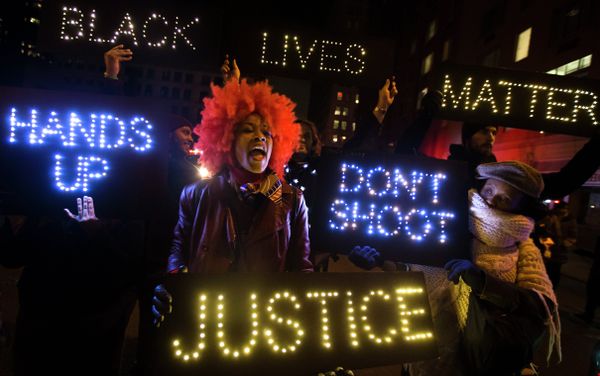 A demonstrator chants during a rally in downtown Manhattan in New York, Saturday, Dec. 13, 2014, during the Justice for All rally and march A demonstrator chants during a rally in downtown Manhattan in New York, Saturday, Dec. 13, 2014, during the Justice for All rally and march - Sputnik International