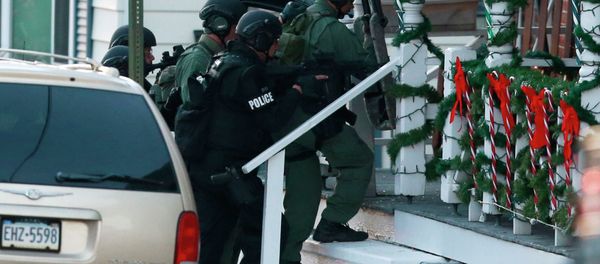Police gather near a home, Monday, Dec. 15, 2014, in Pennsburg, Pa., where suspect Bradley William Stone is believed to have barricaded himself inside after shootings at multiple homes Police gather near a home, Monday, Dec. 15, 2014, in Pennsburg, Pa., where suspect Bradley William Stone is believed to have barricaded himself inside after shootings at multiple homes - Sputnik International