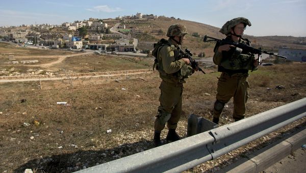 Israeli soldiers stand guard on the main road near the West bank village of Bet Sahour Israeli soldiers stand guard on the main road near the West bank village of Bet Sahour - Sputnik International