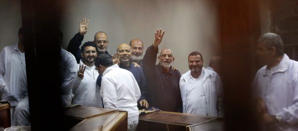 Muslim Brotherhood's Supreme Guide Mohamed Badie (3rd R) with other brotherhood members at a court in the outskirts of Cairo - Sputnik International