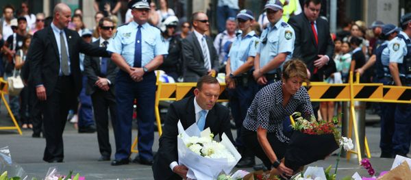 Australian Prime Minister Tony Abbott and his wife Margie pay their respect to the victims of the siege in Martin Place in Sydney central business district, Australia - Sputnik International