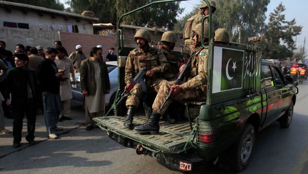Pakistani security forces drive on a road leading to the Army Public School, which is under attack from Taliban gunmen, in Peshawar, December 16, 2014 Pakistani security forces drive on a road leading to the Army Public School, which is under attack from Taliban gunmen, in Peshawar, December 16, 2014 - Sputnik International