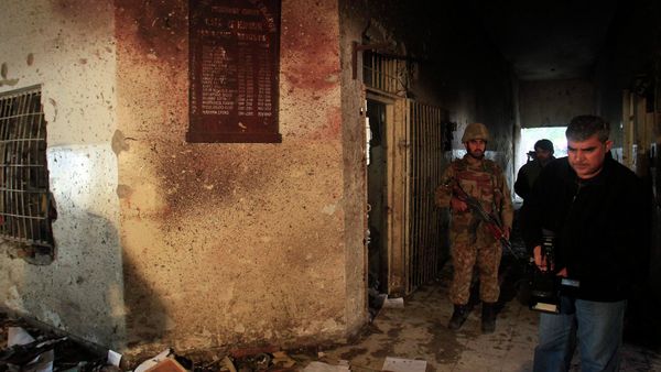 A local cameraman films in front of an army soldier at the Army Public School, which was attacked by Taliban gunmen, in Peshawar, December 17, 2014. A local cameraman films in front of an army soldier at the Army Public School, which was attacked by Taliban gunmen, in Peshawar, December 17, 2014. - Sputnik International
