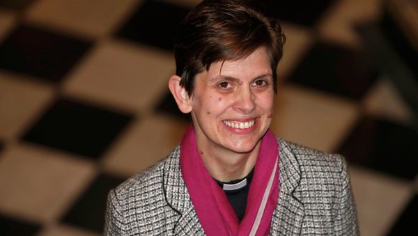 Libby Lane, a suffragan (Assistant) bishop in the Diocese of Chester, poses for photographers after her forthcoming appointment as the new Bishop of Stockport was announced in the Town Hall in Stockport, northern England Libby Lane, a suffragan (Assistant) bishop in the Diocese of Chester, poses for photographers after her forthcoming appointment as the new Bishop of Stockport was announced in the Town Hall in Stockport, northern England - Sputnik International