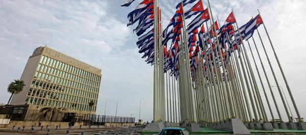 A car drives past the building of the the U.S. diplomatic mission in Cuba, The U.S. Interests Section, (USINT), in Havana, in this September 12, 2013 file picture. A car drives past the building of the the U.S. diplomatic mission in Cuba, The U.S. Interests Section, (USINT), in Havana, in this September 12, 2013 file picture. - Sputnik International