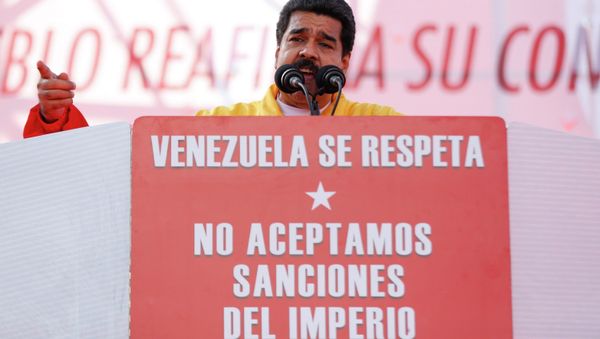 Venezuela's President Nicolas Maduro speaks during a rally to reject the sanctions that the U.S. government seeks to impose on officials accused of human rights violations, in Caracas December 15, 2014. - Sputnik International