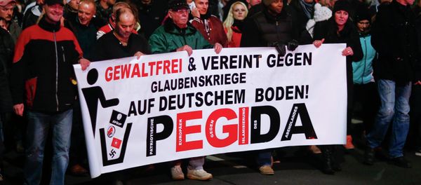 Participants hold a banner during a demonstration called by anti-immigration group PEGIDA, a German abbreviation for Patriotic Europeans against the Islamization of the West, in Dresden December 15, 2014 Participants hold a banner during a demonstration called by anti-immigration group PEGIDA, a German abbreviation for Patriotic Europeans against the Islamization of the West, in Dresden December 15, 2014 - Sputnik International