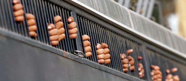 The hands of opposition supporters are seen through a mobile police jail after being arrested during a demonstration against President Gen. Pervez Musharraf in Sheddra on the outskirts of Lahore, Pakistan, Thursday, Nov. 15, 2007 The hands of opposition supporters are seen through a mobile police jail after being arrested during a demonstration against President Gen. Pervez Musharraf in Sheddra on the outskirts of Lahore, Pakistan, Thursday, Nov. 15, 2007 - Sputnik International