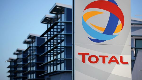 View of the logo of French oil giant Total in front of the oil refinery of Donges, near Nantes, in this December 20, 2013 file photo - Sputnik International