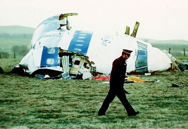 A police officer walks by the nose of Pan Am flight 103 in a field near the town of Lockerbie A police officer walks by the nose of Pan Am flight 103 in a field near the town of Lockerbie - Sputnik International