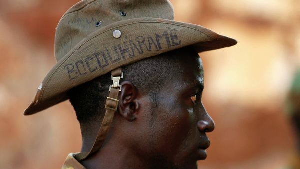 PICTURES OF THE YEAR 2014 A Seleka fighter wears a hat that reads Bocou Harame, in a reference to the Islamist militant group Boko Haram, in the town of Bria, in this April 9, 2014 file photo - Sputnik International