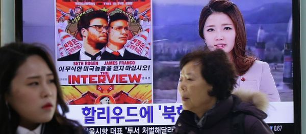 People walk past a TV screen showing a poster of Sony Picture's The Interview in a news report, at the Seoul Railway Station in Seoul, South Korea, Monday, Dec. 22, 2014 People walk past a TV screen showing a poster of Sony Picture's The Interview in a news report, at the Seoul Railway Station in Seoul, South Korea, Monday, Dec. 22, 2014 - Sputnik International