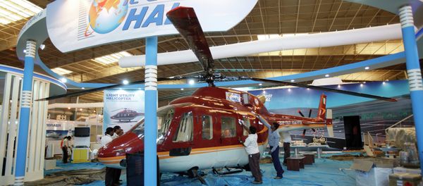 Workers polish a helicopter at the stall of Hindustan Aeronautics Ltd. on the eve of Aero India 2011 at Yelahanka air base on the outskirts of Bangalore, India, Tuesday, Feb. 8, 2011 Workers polish a helicopter at the stall of Hindustan Aeronautics Ltd. on the eve of Aero India 2011 at Yelahanka air base on the outskirts of Bangalore, India, Tuesday, Feb. 8, 2011 - Sputnik International