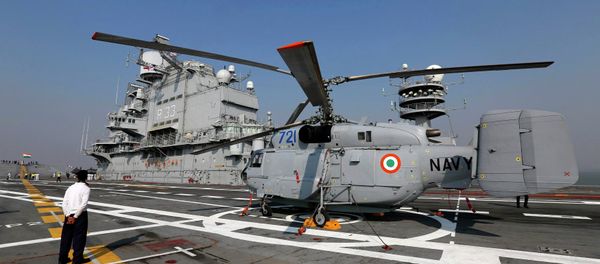 A Kamov 31 helicopter is parked on the deck of INS Vikramaditya, Indian Navy's aircraft carrier, is seen anchored in the Arabian sea off the coast of Mumbai December 3, 2014 A Kamov 31 helicopter is parked on the deck of INS Vikramaditya, Indian Navy's aircraft carrier, is seen anchored in the Arabian sea off the coast of Mumbai December 3, 2014 - Sputnik International