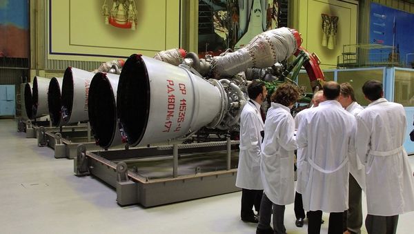 Energomash company employees stand near RD-180 engines prepared for shipment to the United States in a shop at the Energomash - Sputnik International