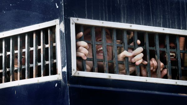 Detained American Muslims shout from a prison van as they leave an anti terrorist court after their court appearance in Sargodha, Pakistan Detained American Muslims shout from a prison van as they leave an anti terrorist court after their court appearance in Sargodha, Pakistan - Sputnik International