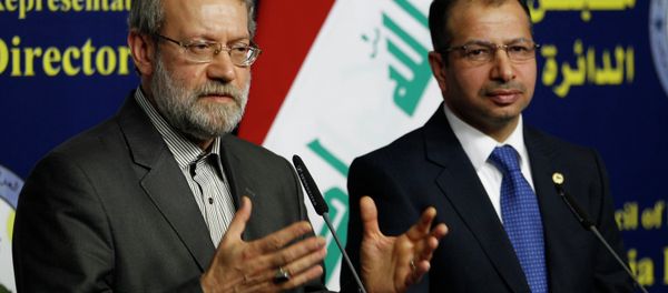 Iran's parliament speaker Ali Larijani (L) and Iraqi parliament speaker Salim al-Jabouri speak during a news conference in Baghdad December 24, 2014 - Sputnik International